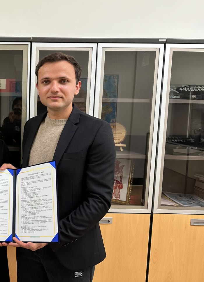 Babar Ali Khan with a signed agreement